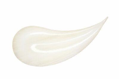 Lip gloss sample isolated on white. Smudged pink lipgloss